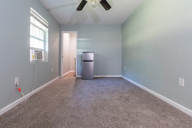 carpeted empty room with cooling unit and ceiling fan