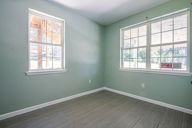 spare room with a healthy amount of sunlight