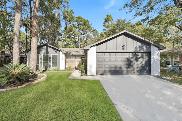 view of front of home with a front lawn and a garage