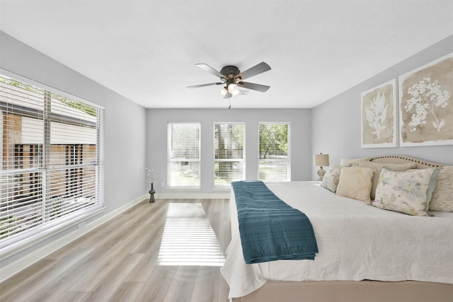 bedroom featuring light hardwood / wood-style flooring and ceiling fan