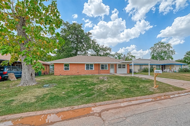 single story home featuring a front lawn and a carport