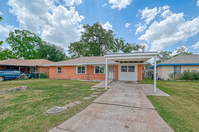 ranch-style home with a front yard and a carport