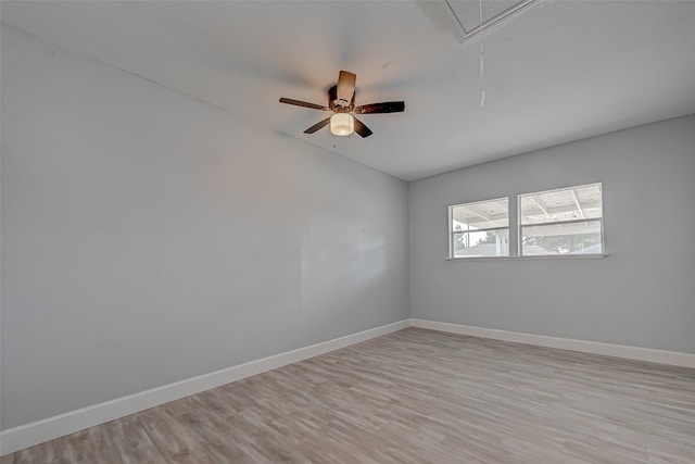 empty room featuring light wood-type flooring and ceiling fan