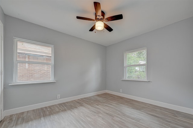 unfurnished room featuring light hardwood / wood-style flooring and ceiling fan