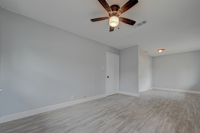 unfurnished room with light hardwood / wood-style flooring and ceiling fan