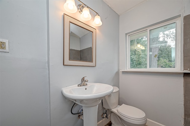 bathroom featuring toilet and sink