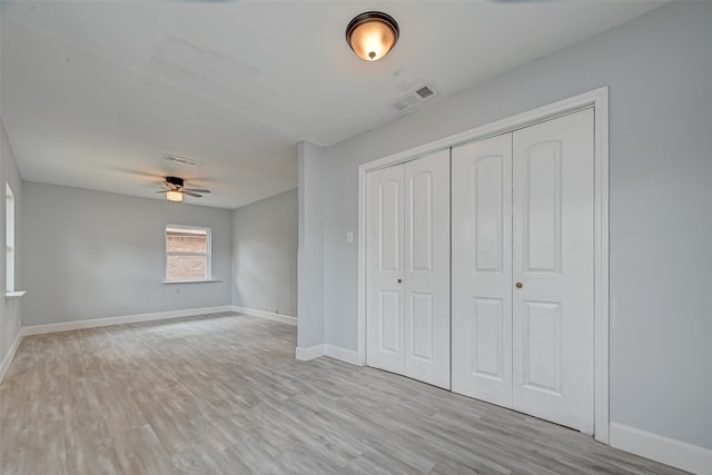 unfurnished bedroom featuring light hardwood / wood-style flooring and ceiling fan