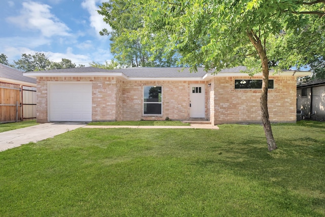 single story home featuring a front lawn and a garage