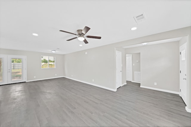 interior space featuring french doors, hardwood / wood-style floors, and ceiling fan