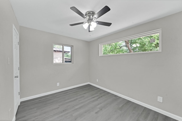 unfurnished room featuring hardwood / wood-style floors and ceiling fan