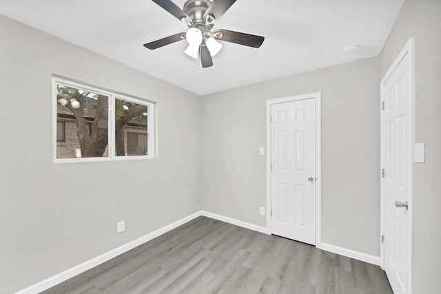 unfurnished bedroom with light wood-type flooring and ceiling fan