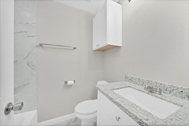 full bathroom with vanity, tiled shower / bath combo, and toilet