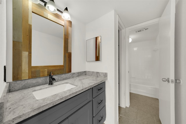 bathroom with vanity and tile patterned flooring