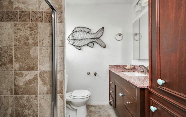 bathroom with vanity, an enclosed shower, toilet, and tile patterned flooring