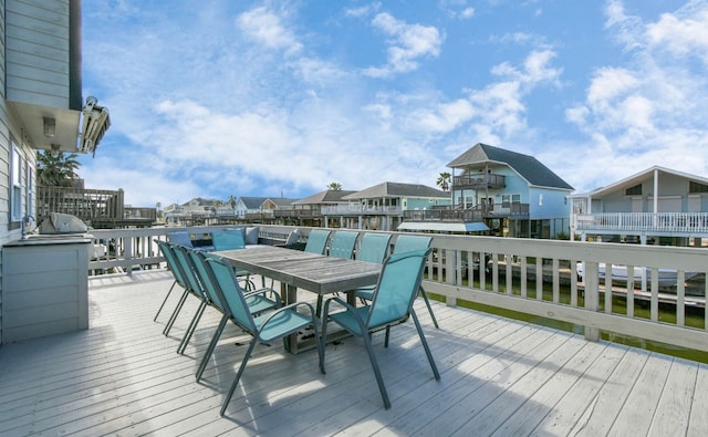 wooden deck with a water view