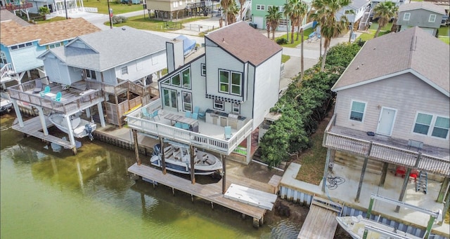 birds eye view of property with a water view