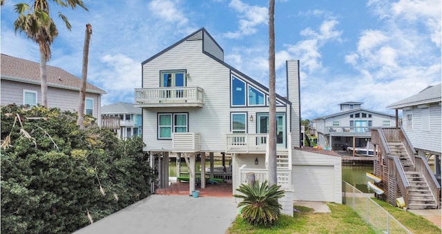 back of house featuring a carport