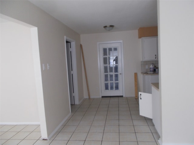 hall with light tile patterned flooring