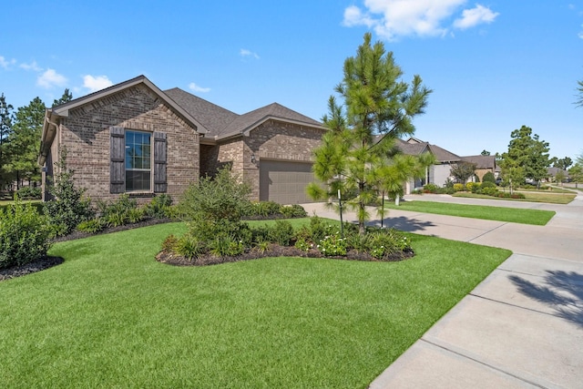 view of front of home featuring a garage and a front lawn