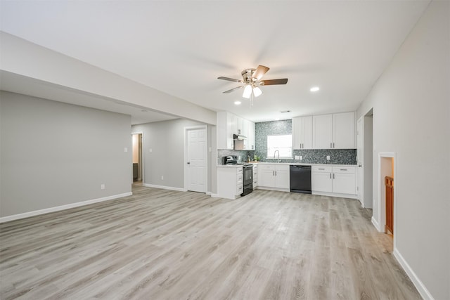 kitchen with backsplash, ceiling fan, sink, black appliances, and white cabinetry