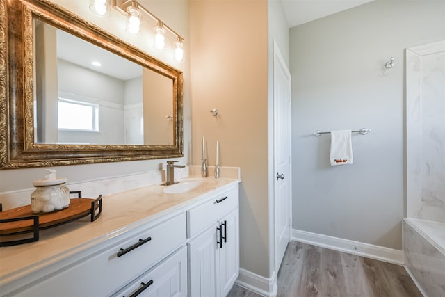 bathroom with wood-type flooring and vanity