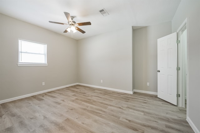 spare room featuring light hardwood / wood-style floors and ceiling fan