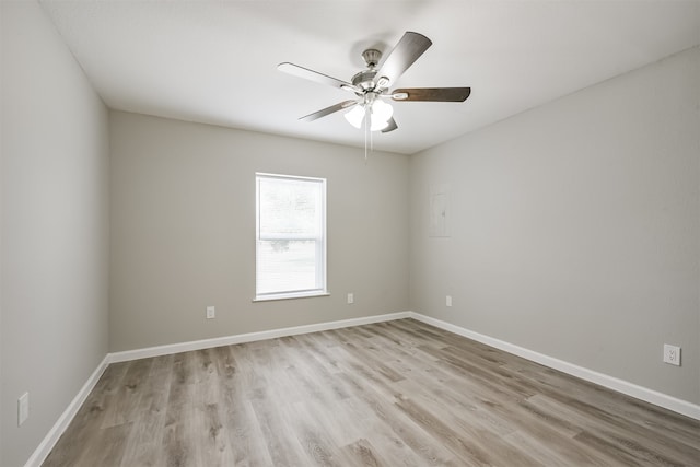 unfurnished room featuring ceiling fan and light hardwood / wood-style floors