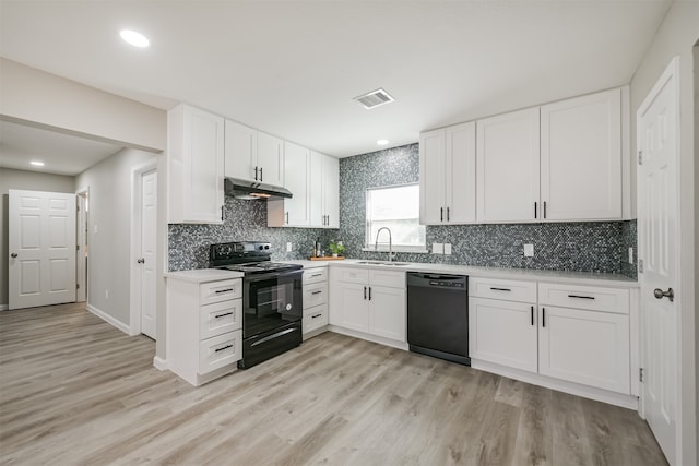 kitchen with backsplash, sink, black appliances, light hardwood / wood-style flooring, and white cabinetry