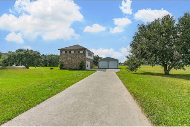 view of front of house featuring an outbuilding and a front lawn