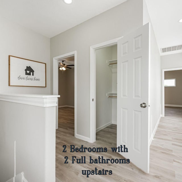 hallway with light wood-type flooring