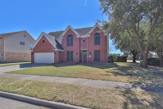 view of front facade with a front yard and a garage