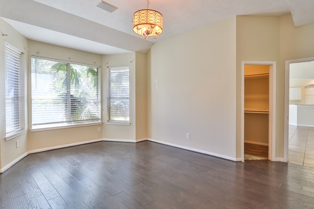 empty room with dark wood-type flooring