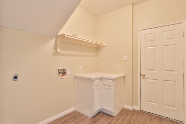 laundry room with light hardwood / wood-style flooring and hookup for a washing machine