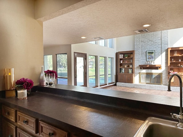 kitchen featuring sink and a textured ceiling