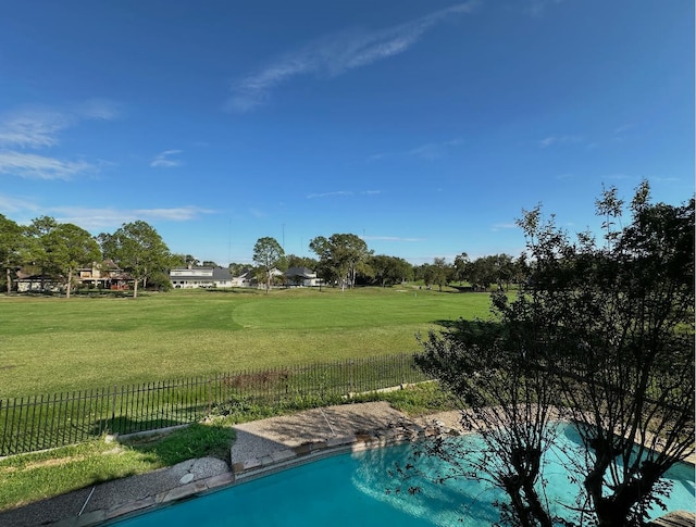 view of pool featuring a yard