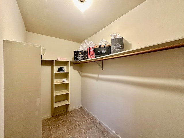 spacious closet featuring tile patterned floors