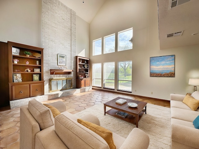 living room featuring light hardwood / wood-style flooring and high vaulted ceiling