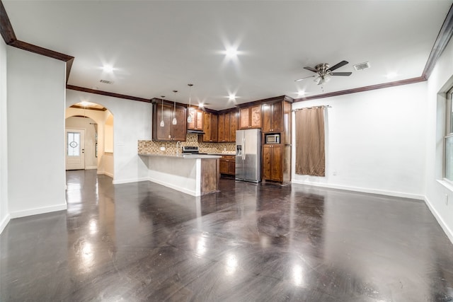 kitchen with crown molding, kitchen peninsula, appliances with stainless steel finishes, and decorative light fixtures