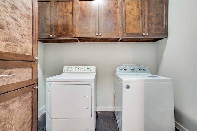 laundry room with cabinets and washer and clothes dryer