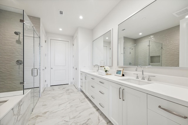 bathroom with a sink, marble finish floor, recessed lighting, visible vents, and a stall shower