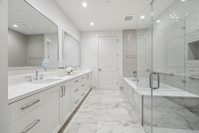 bathroom featuring vanity and shower with separate bathtub