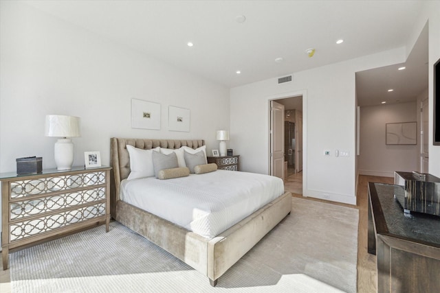 bedroom featuring light wood finished floors, recessed lighting, and visible vents