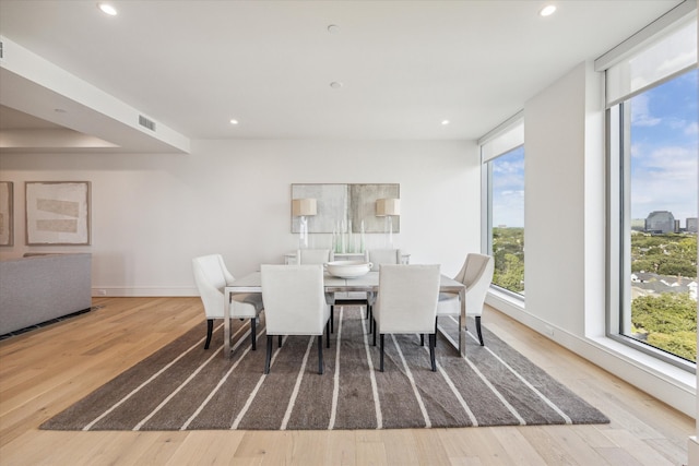 dining area with wood-type flooring