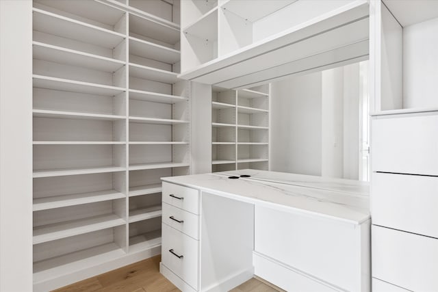 walk in closet featuring light wood-type flooring