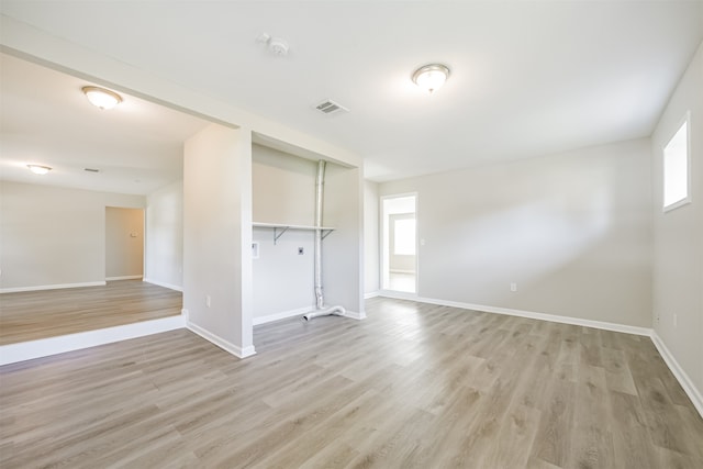 unfurnished living room with light wood-type flooring