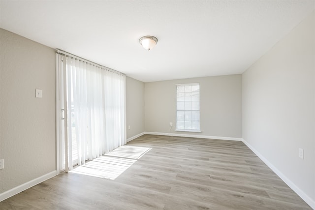 spare room with light hardwood / wood-style floors