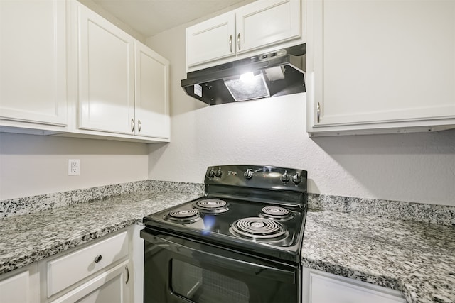 kitchen featuring black electric range and white cabinets