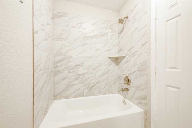 bathroom featuring tiled shower / bath combo