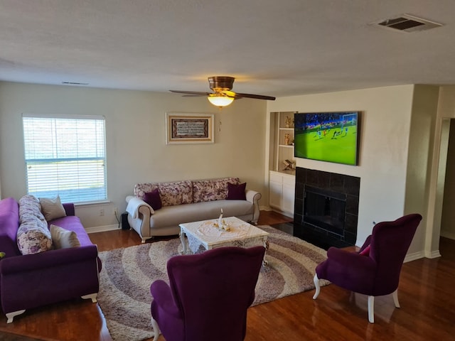 19626 Tularosa Ln, Tomball, TX 77377 - living area featuring wood finished floors, baseboards, a fireplace, and ceiling fan