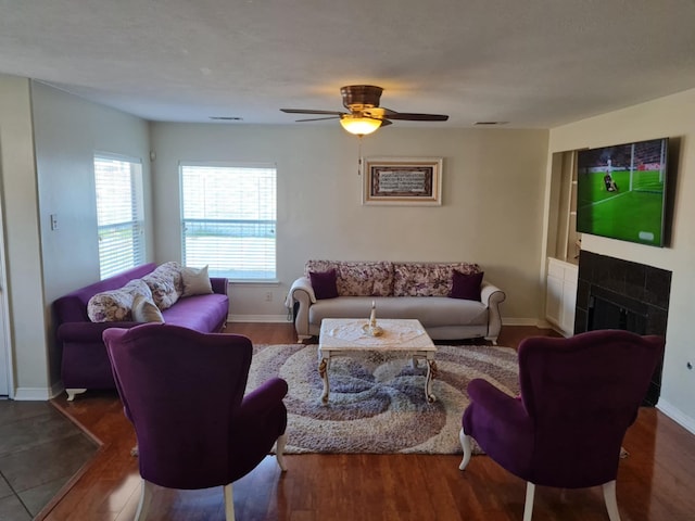 19626 Tularosa Ln, Tomball, TX 77377 - living room with healthy amount of natural light, wood finished floors, a fireplace, and baseboards